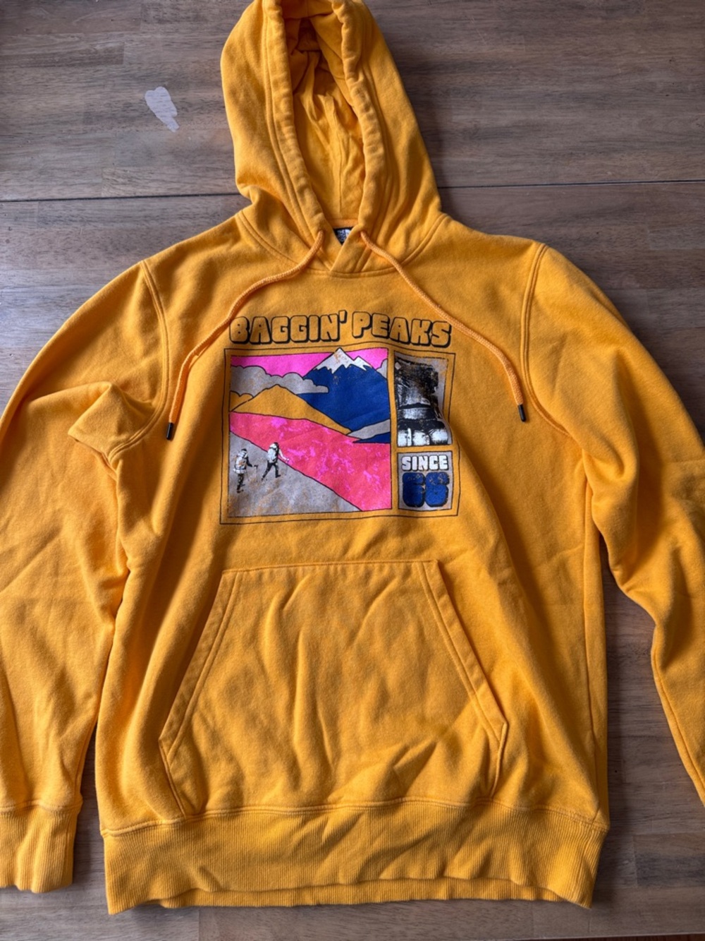 The North Face Golden Yellow Pullover Hoodie with Mountain Graphic